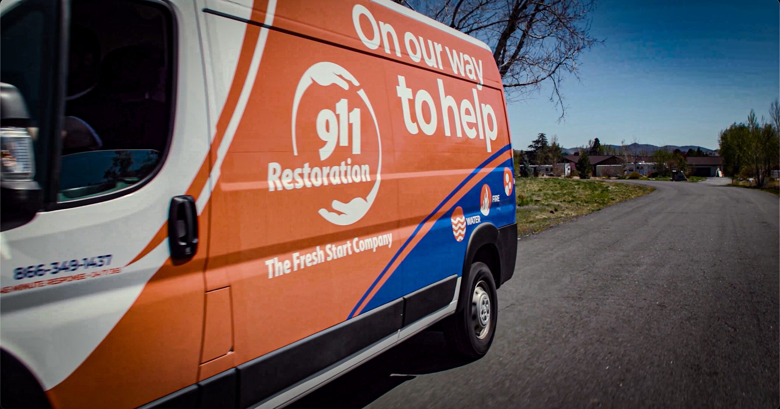911 Restoration of Reno Tahoe work van on a residential street